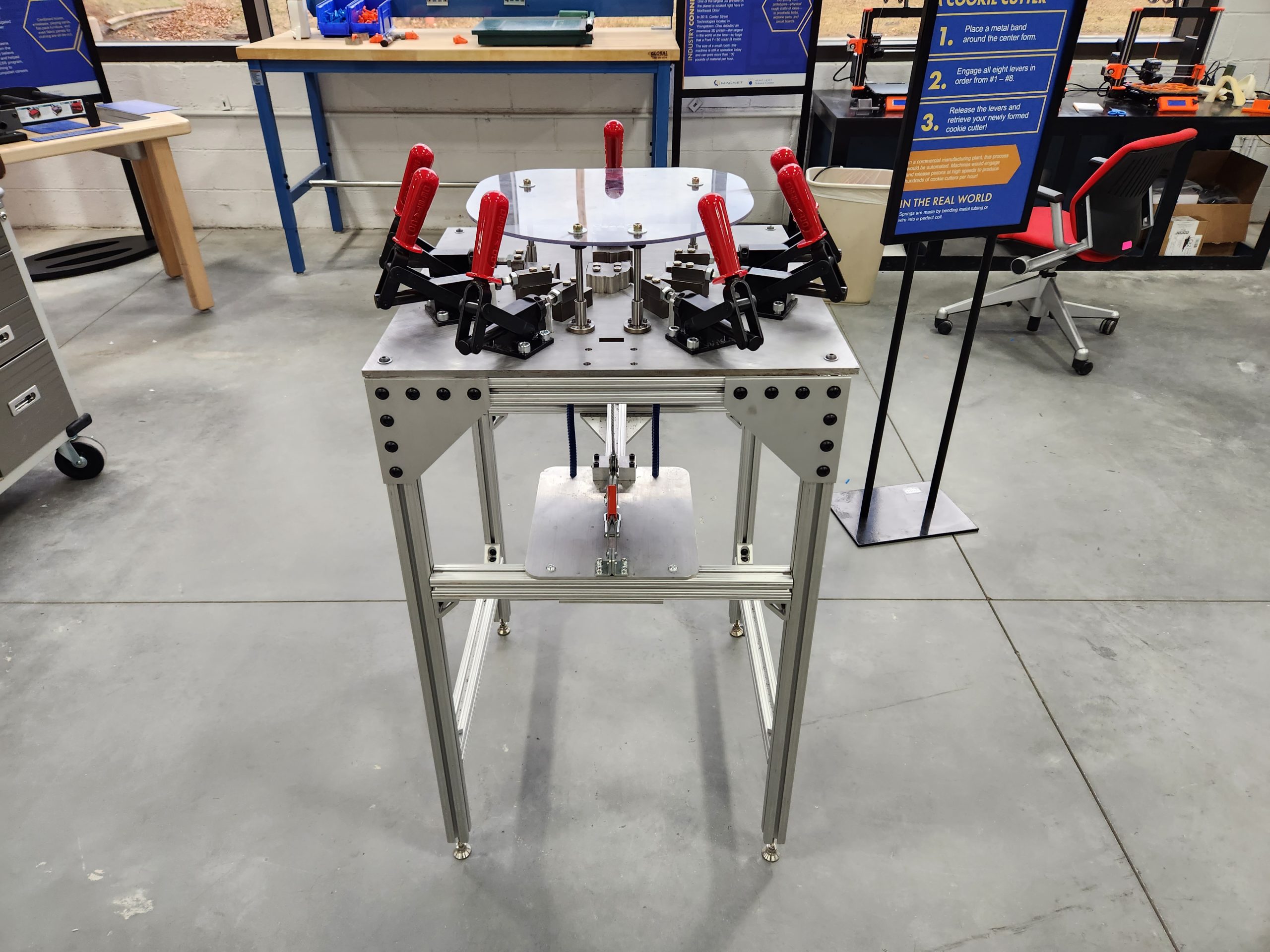 Custom-built cookie cutter sheet metal forming machine showing the tool and work area