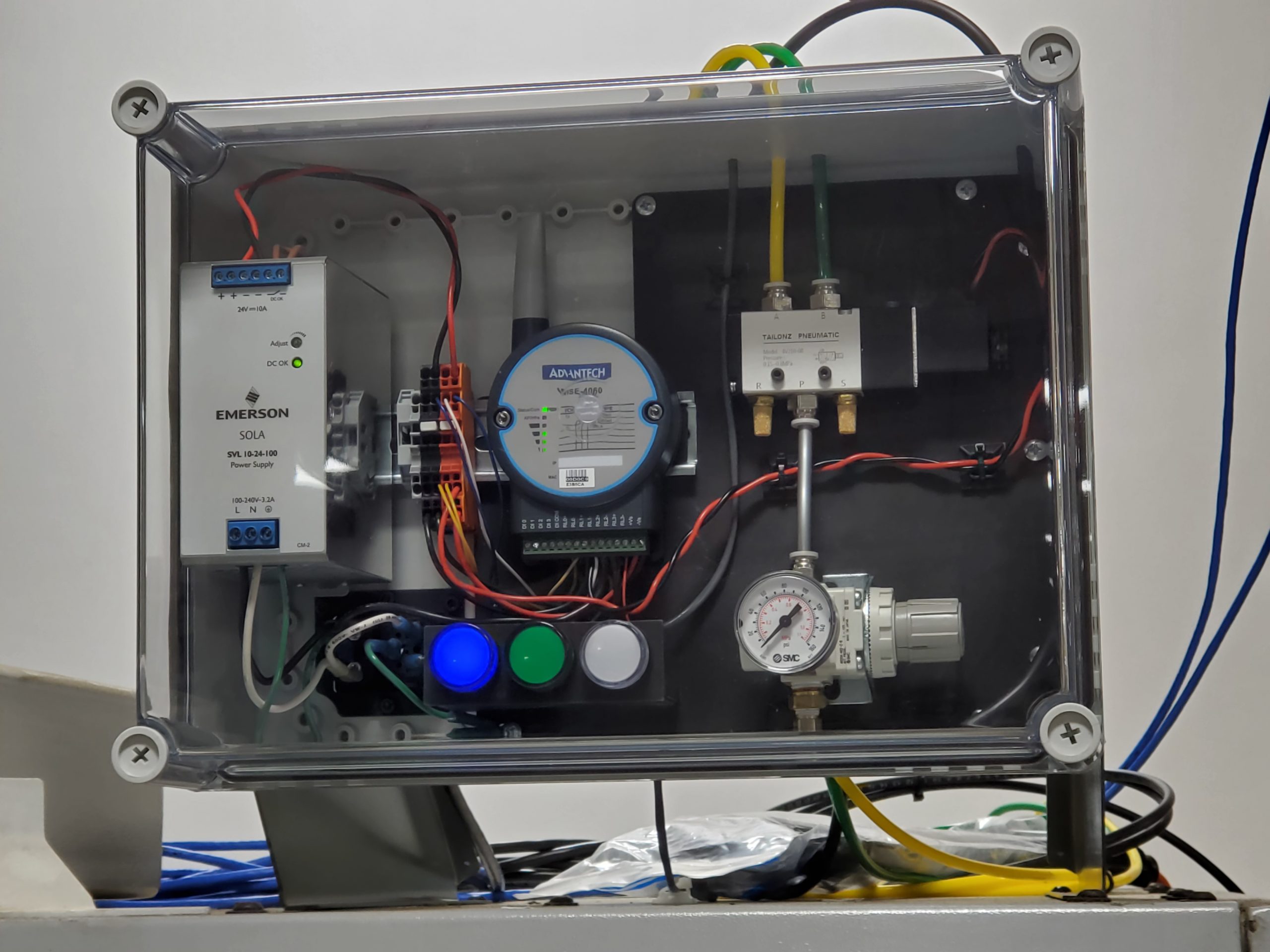 Wireless control hardware mounted near the door of a CNC machine